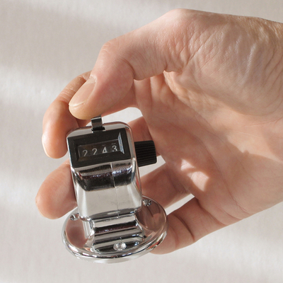 Mechanical handheld counter with  base